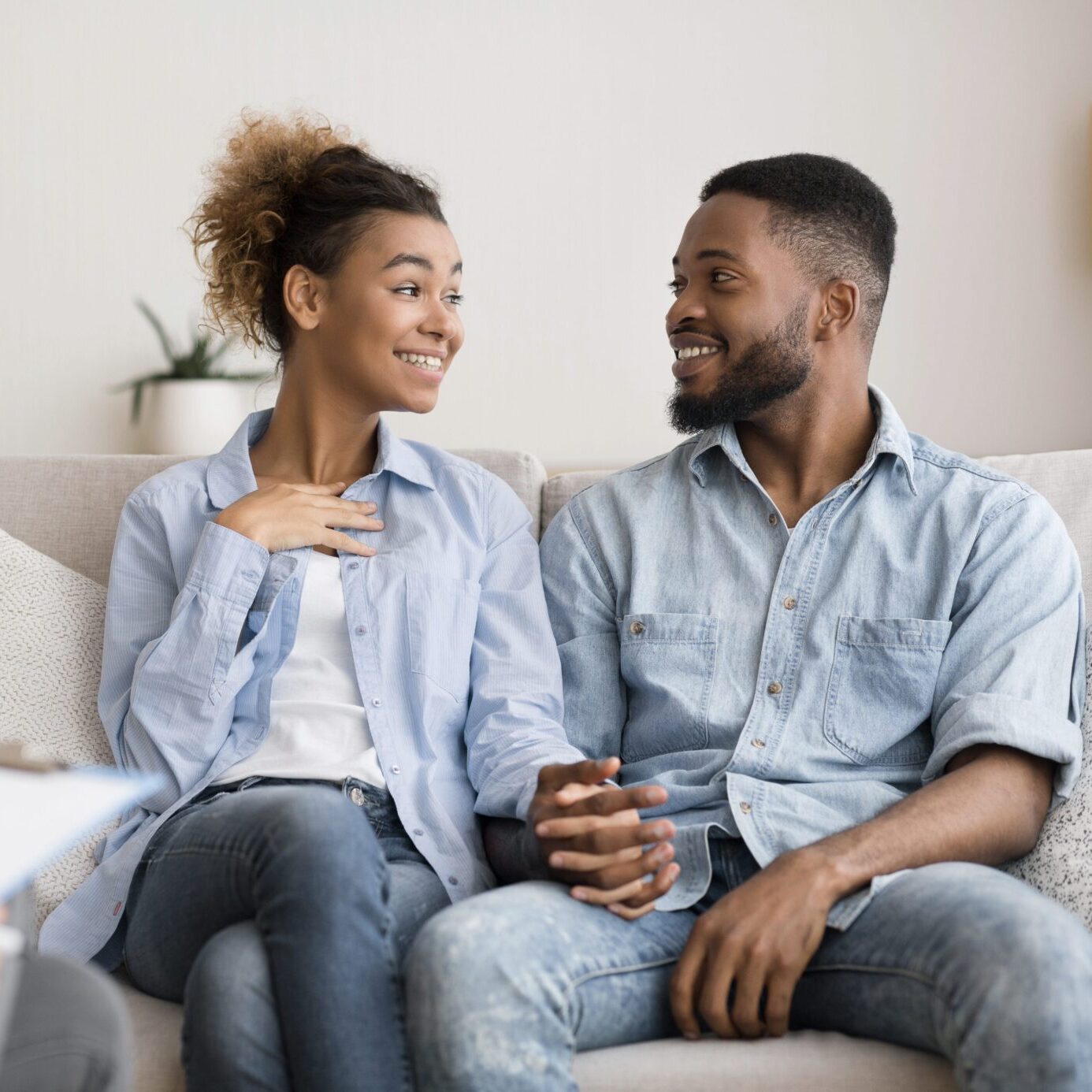 Couple engaging in therapy conversation with licensed clinician in NYC